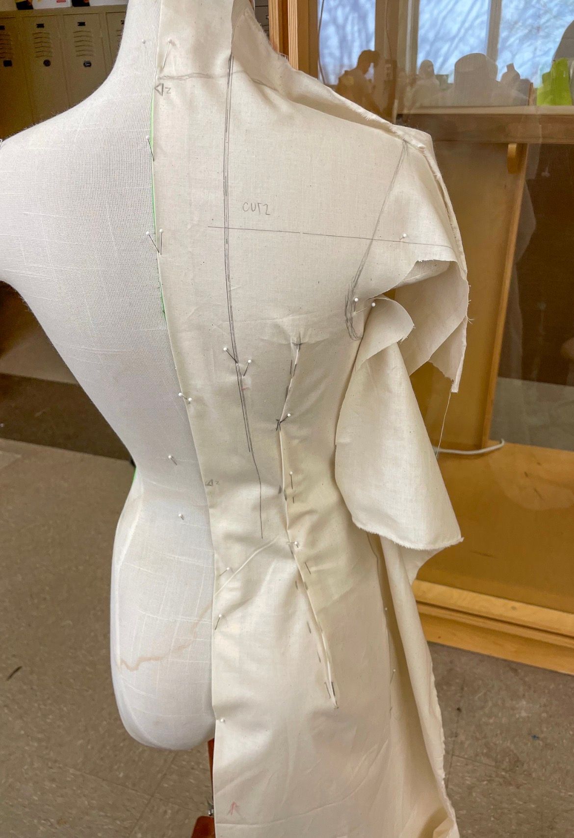 Draping in Progress: Muslin draped and marked on the form