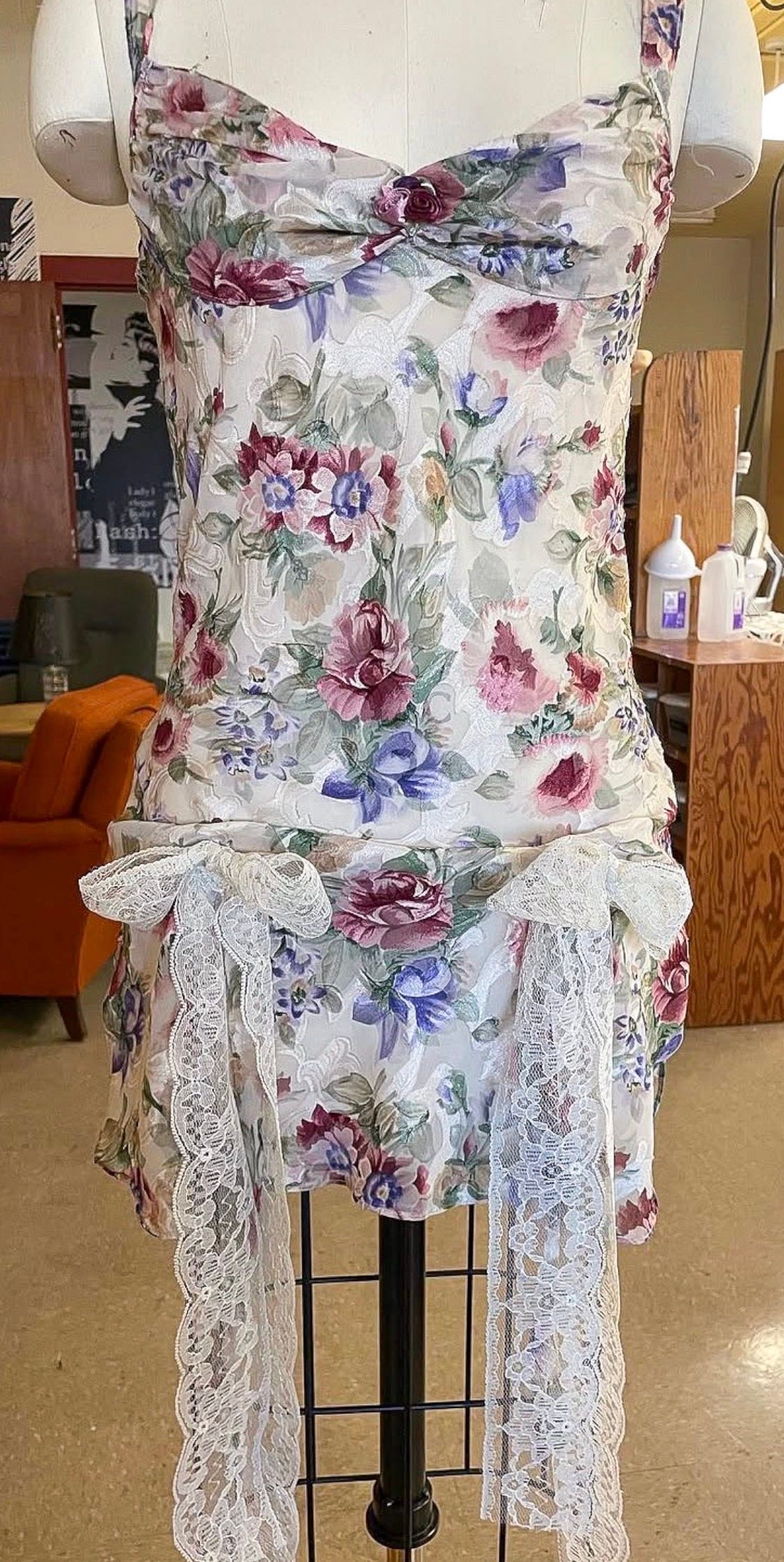 Floral Dress: Custom floral dress with lace sashes at the hip