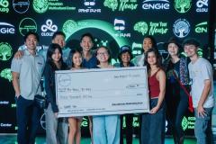 Young people, partners and the Be Peace – Be Hope team holding the Asian American Youth Giving Circle’s check for HOPE:ON in front of the sponsors’ wall at Game Guys