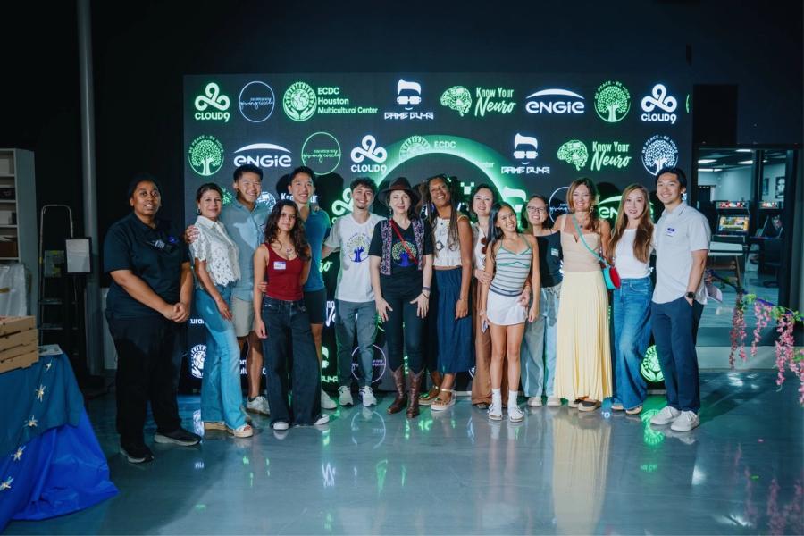 Organizers, young people and partners together in front of the glowing HOPE:ON sponsors’ wall