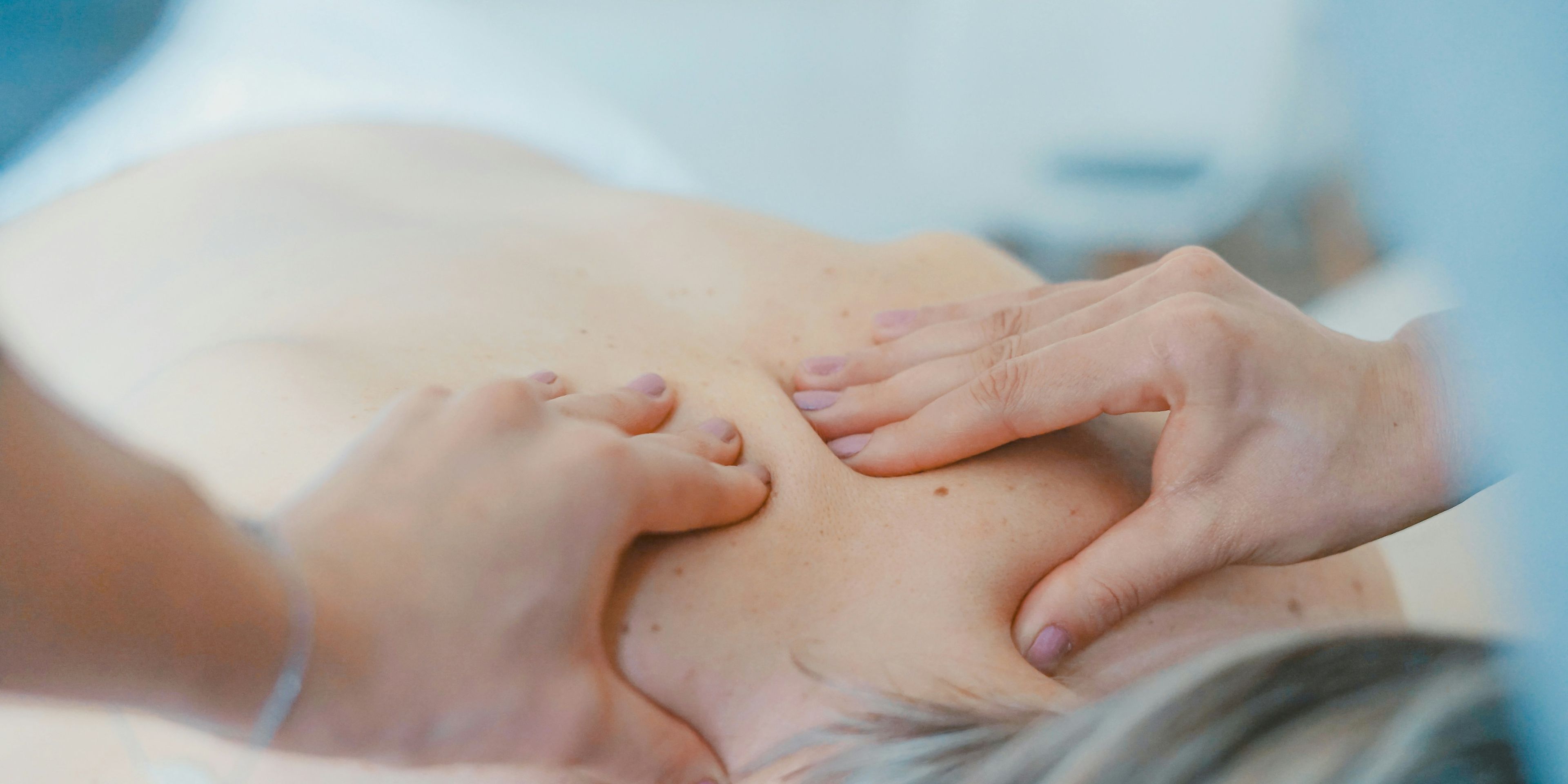 a woman is getting a massage on her back at a spa .
