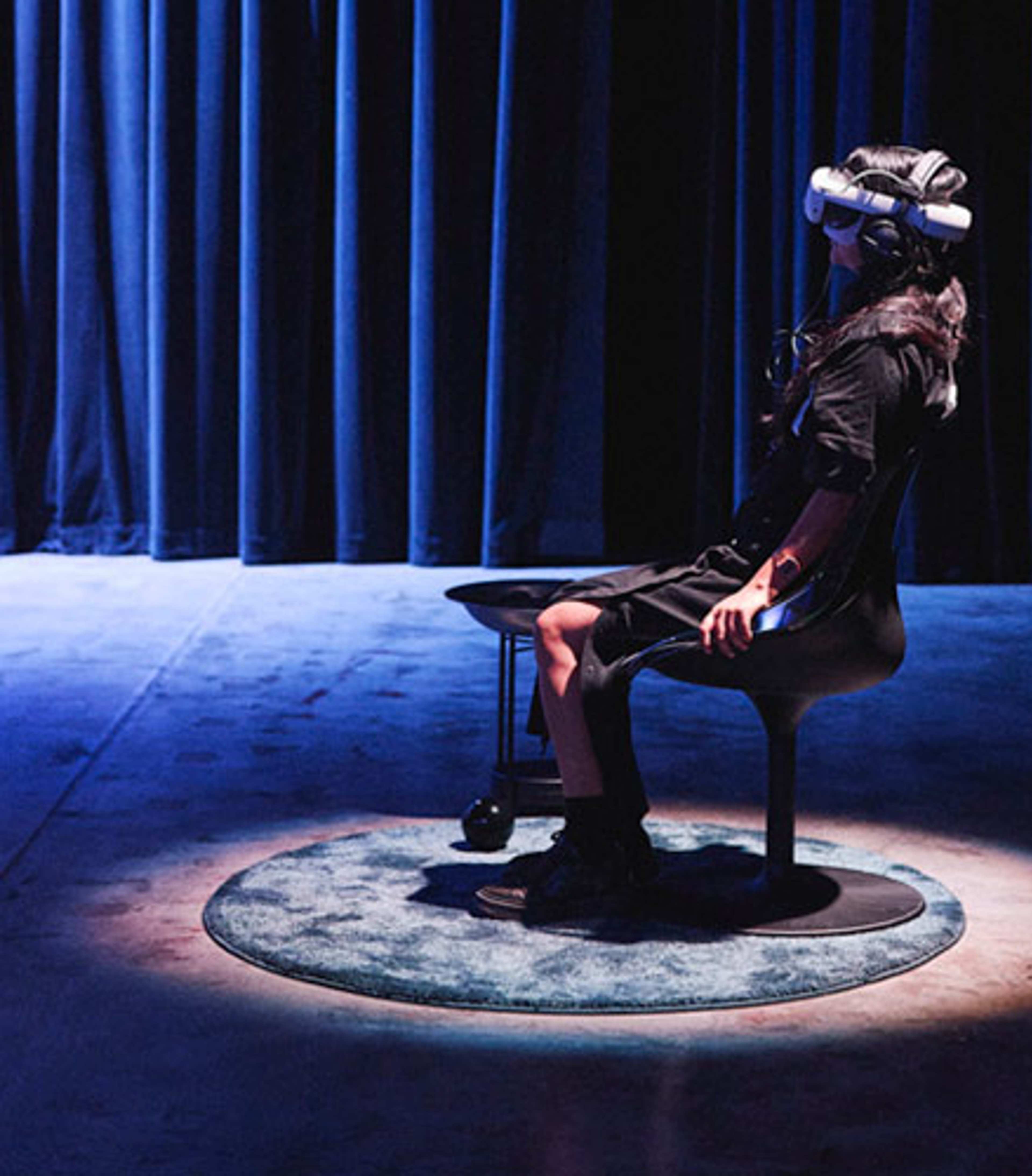 A person wearing a device on their face in the middle of a room.