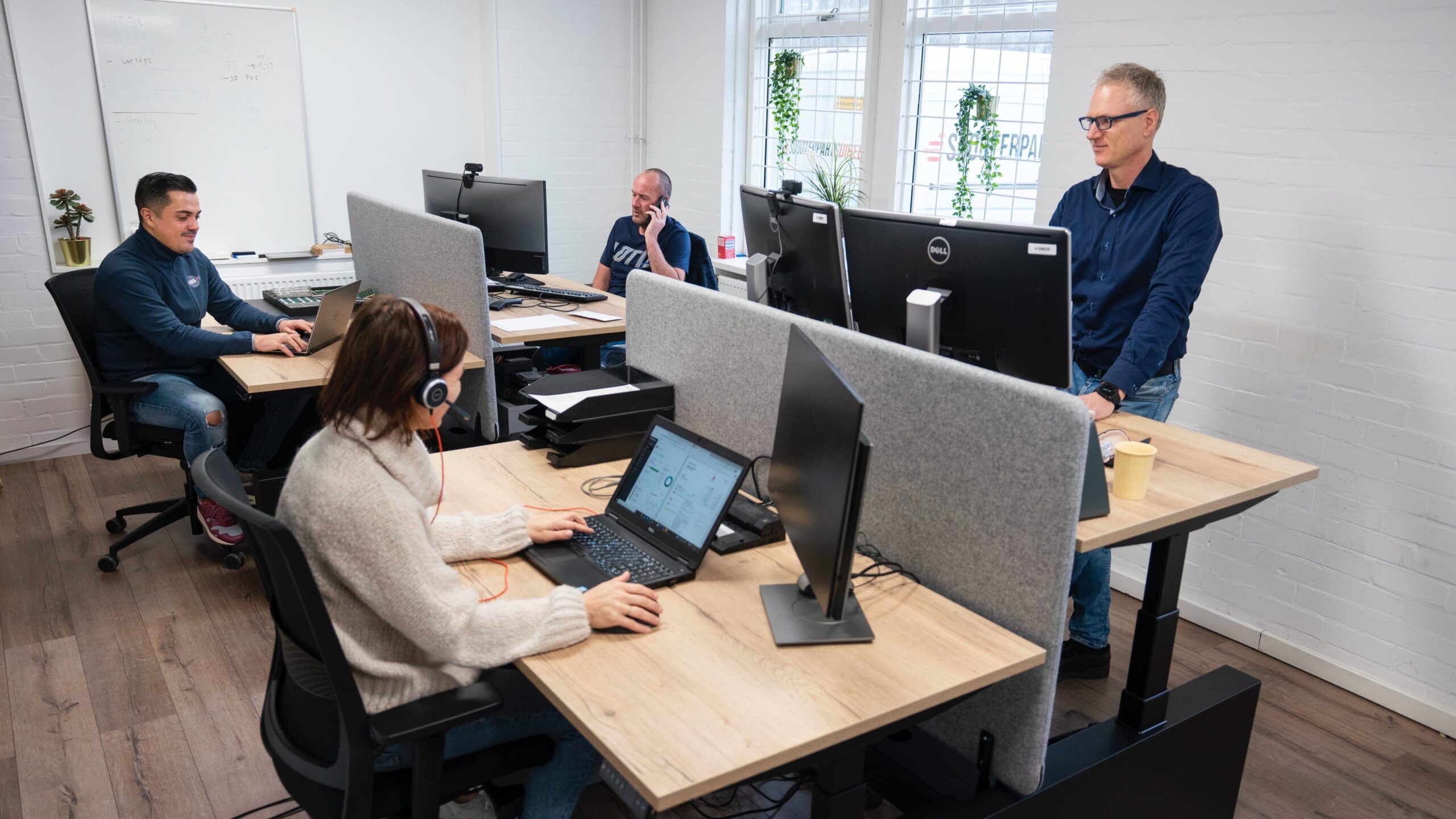 Persons behind desks