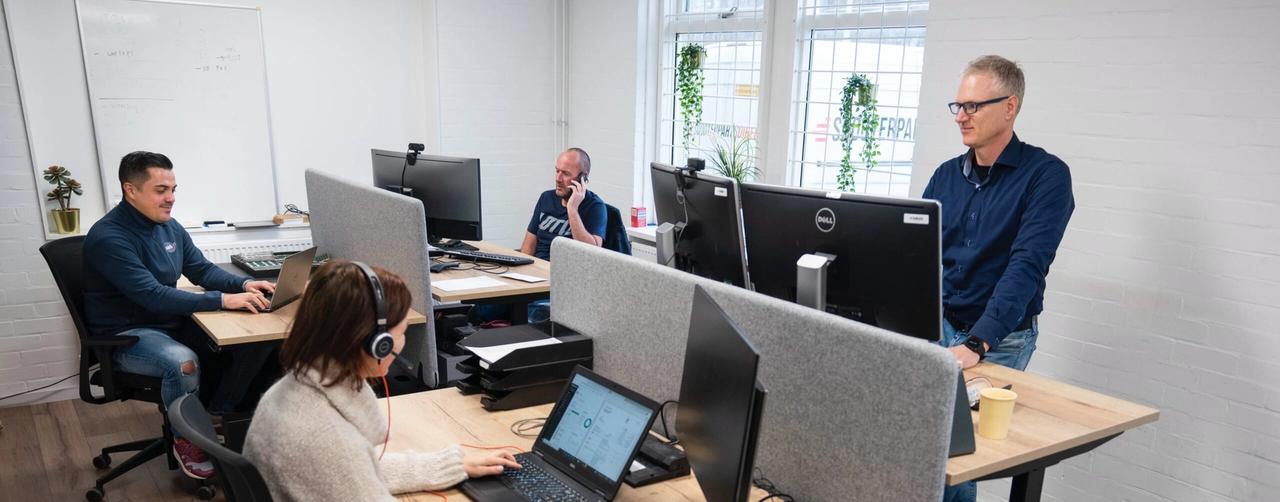 Persons behind desks