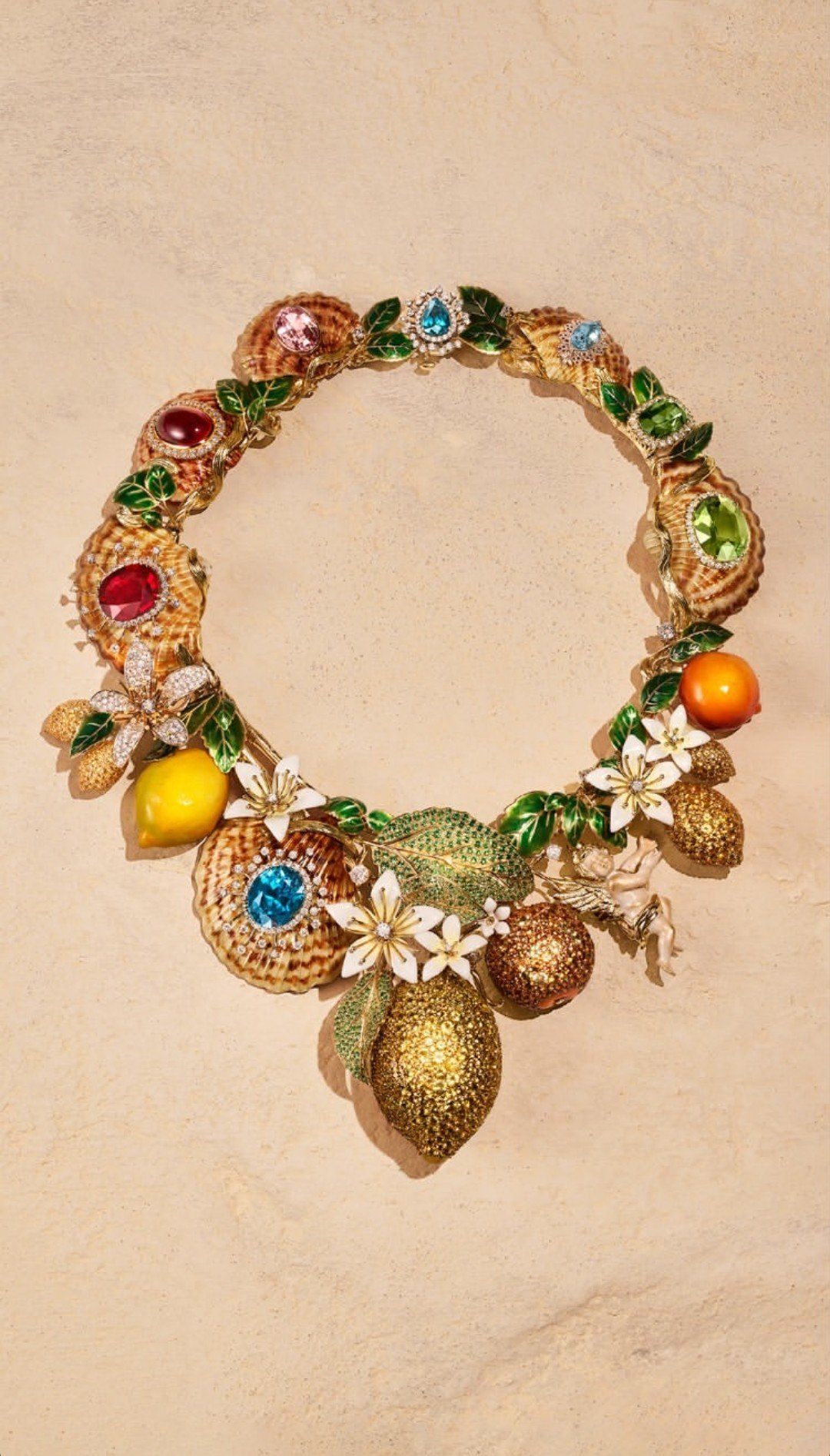 A Dolce & Gabbana Alta Gioielleria necklace made of gold seashells, enamelled lemons and oranges, and a small gold cherub.