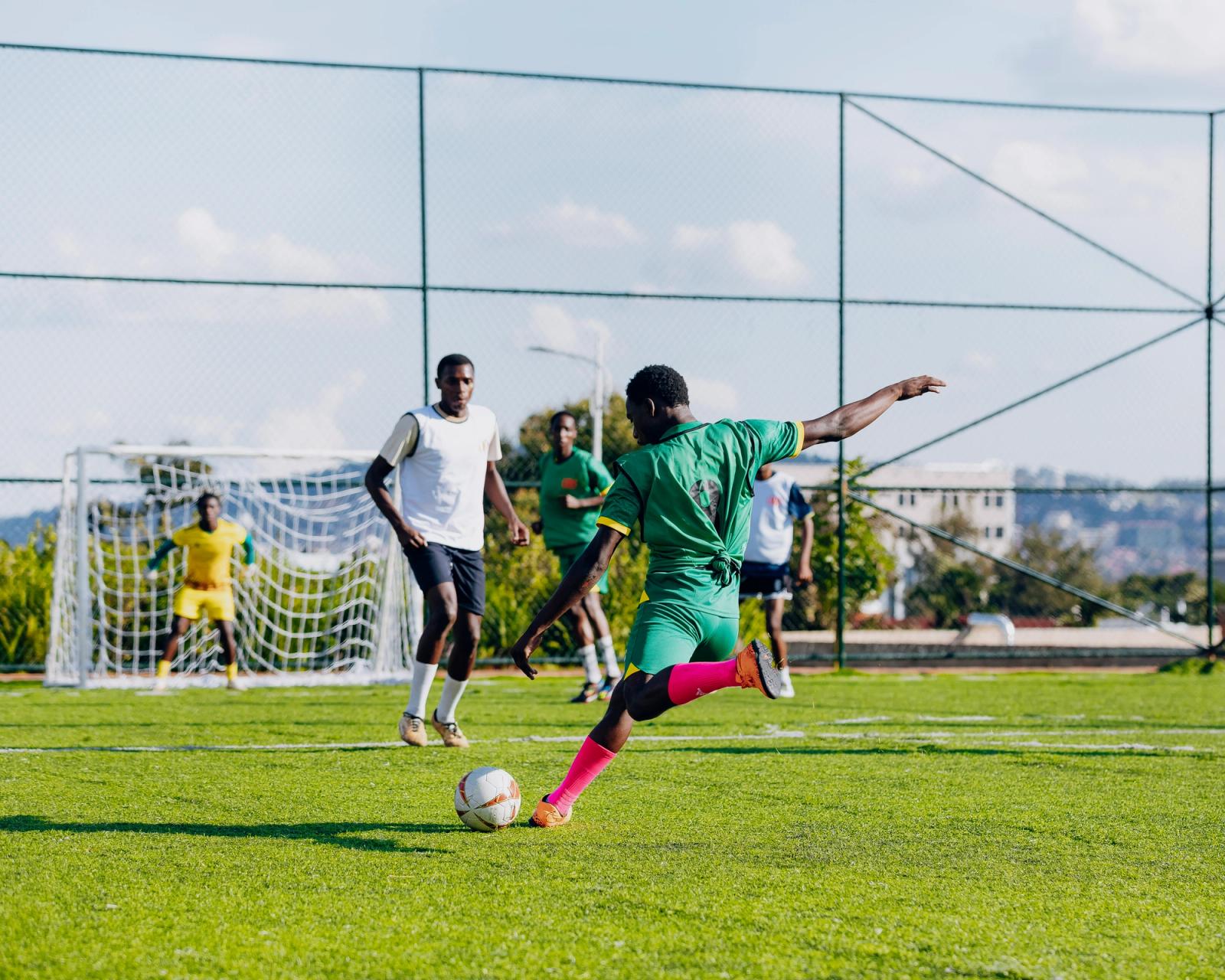 A player unleashes a shot at goal with the keeper set