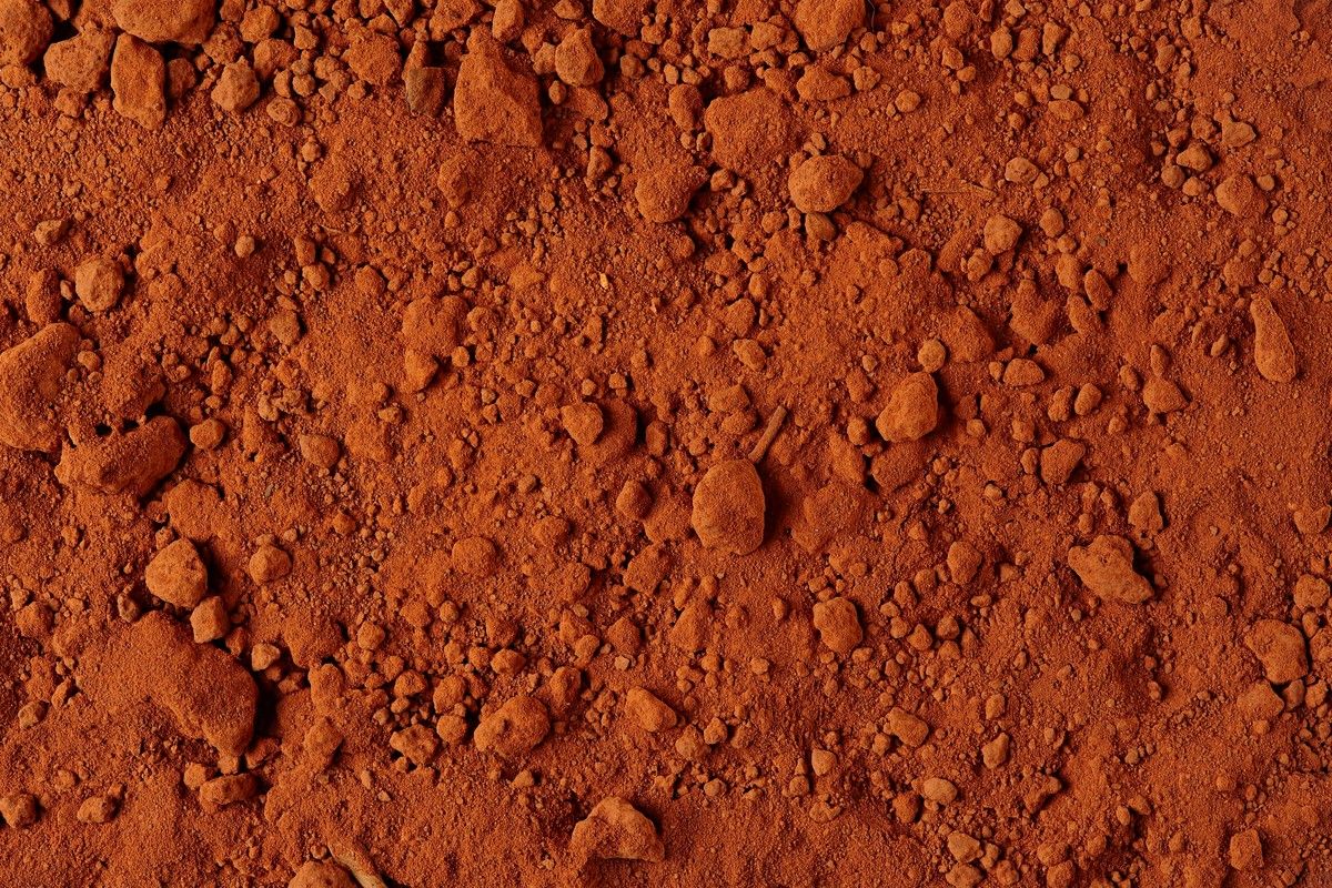 Red mud and ore tailings used in carbon fiber geopolymer for electromagnetic properties