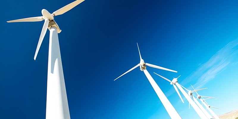 Carbon fiber wind blades self-curve on cooling, eliminating the need for molds