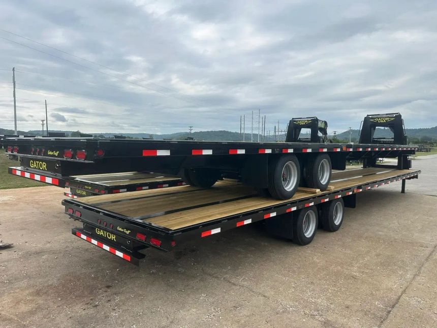 Two-gatormade-gooseneck-trailers-stacked-on-top-of-each-other