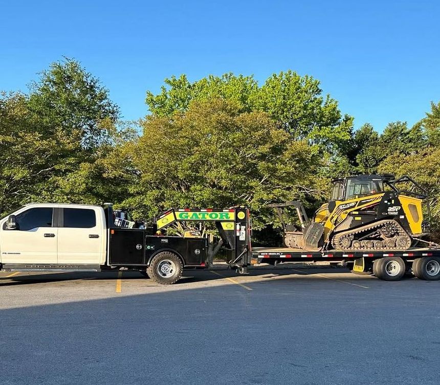 Heavy-duty-Gatormade-equipment-trailer-transporting-construction-machinery