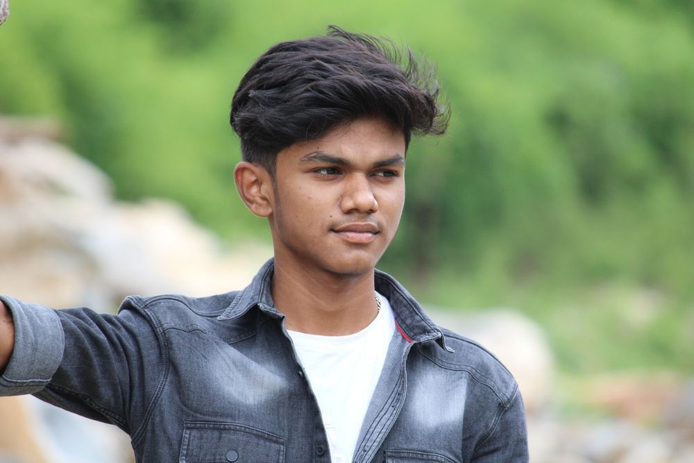 A confident teenage boy outdoors