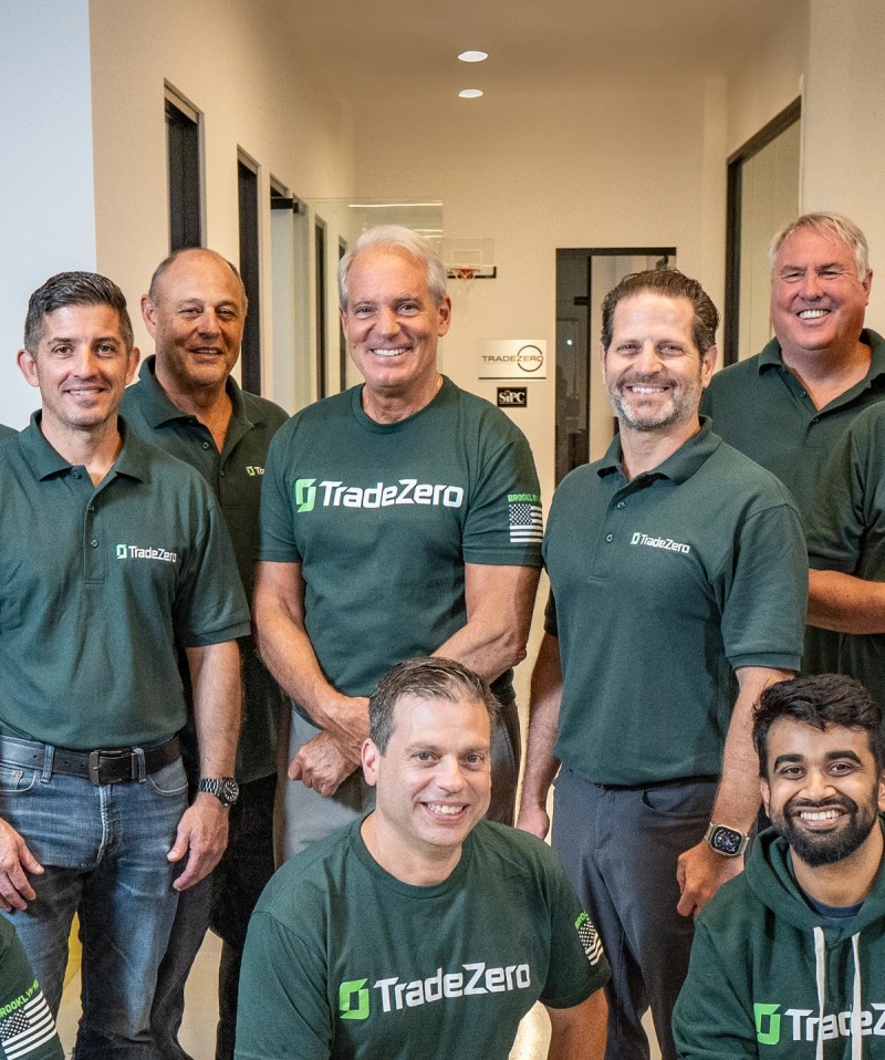 TradeZero team standing for a group picture smiling
