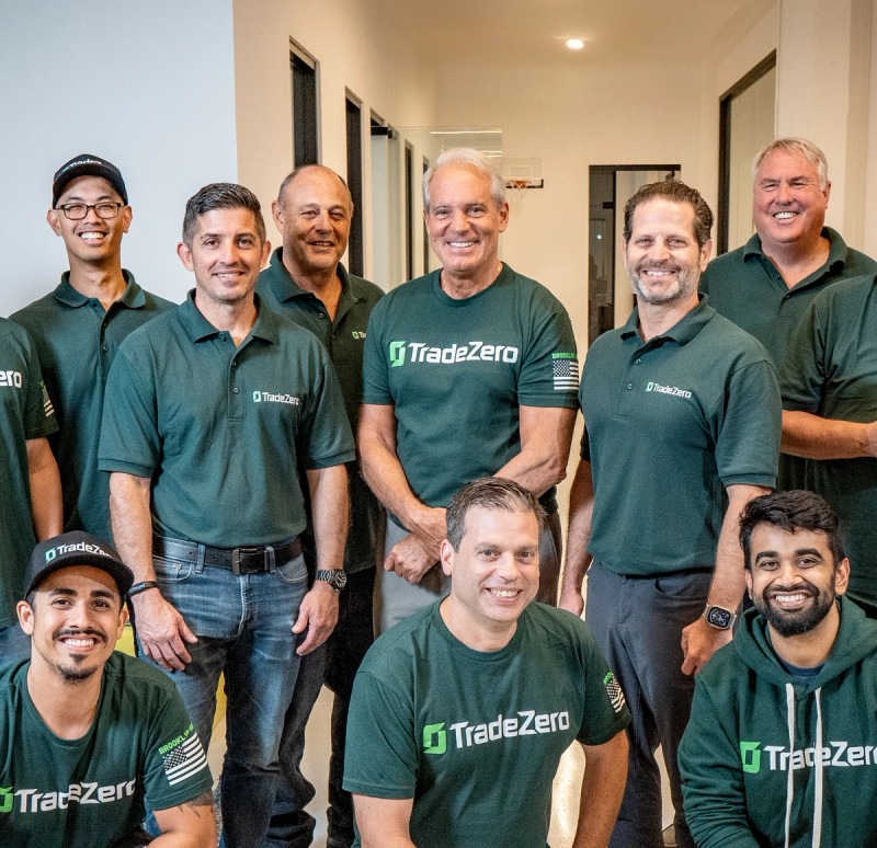 TradeZero team standing for a group picture smiling