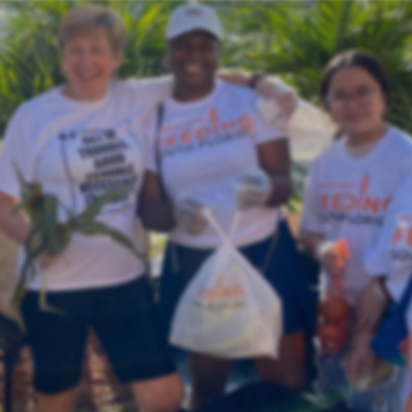 Smiling young ladies doing charity
