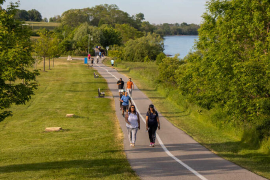 Folks taking a stroll down the Water Front Tail. Image courtesy of waterfronttrail.org