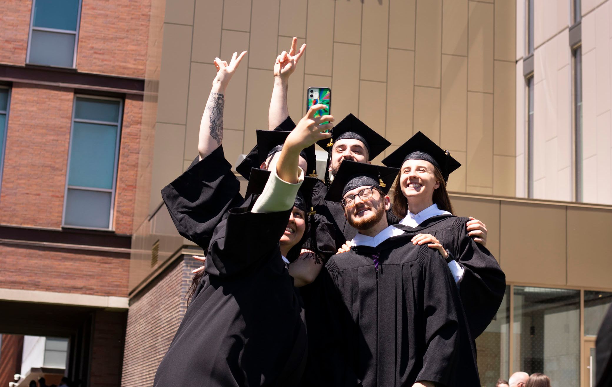 Graduates taking a selfie 