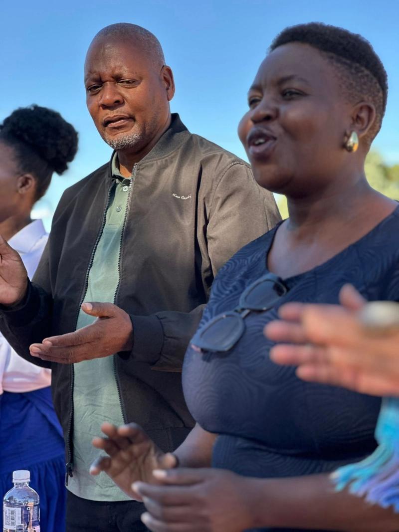 A speaker addresses the Ledumang community during the event.