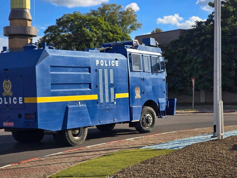 A Botswana Police Service vehicle parked near the protest route.