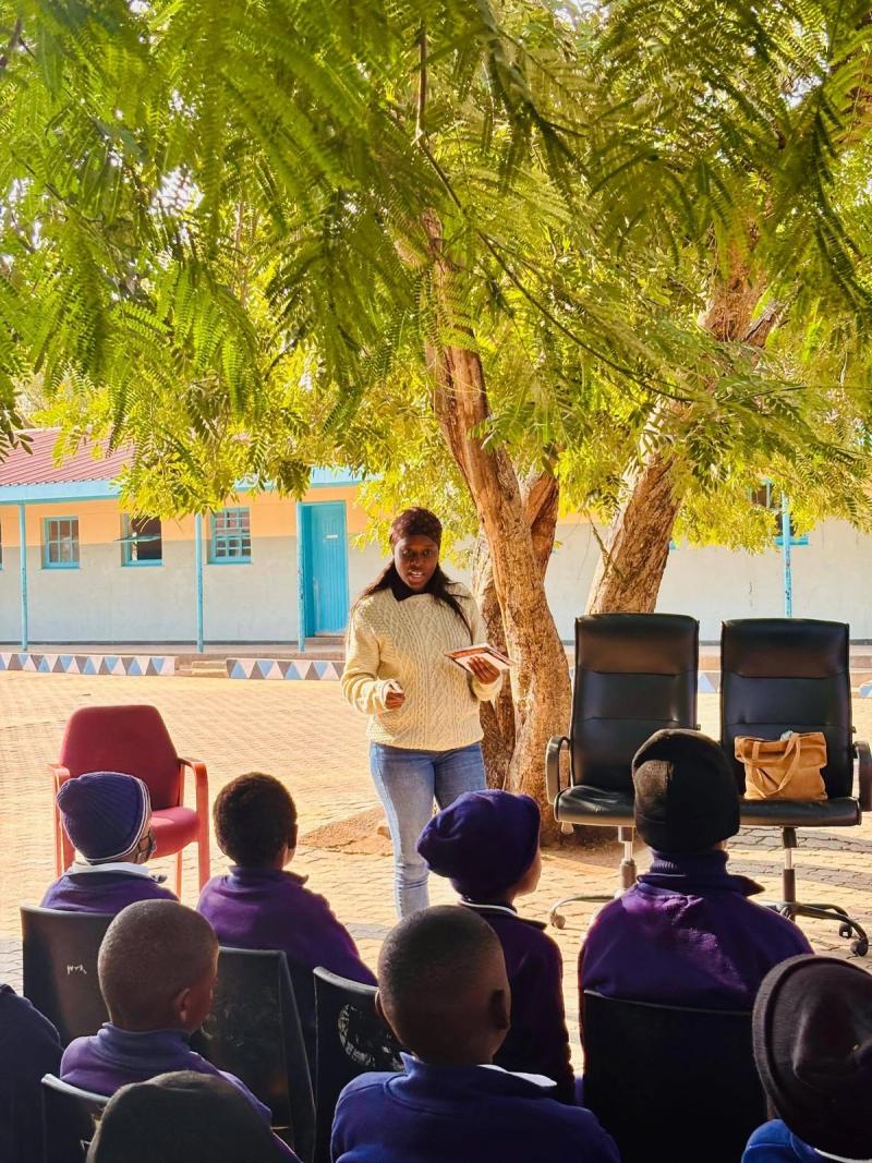 Learners receive donated copies of the anti-bullying book at school.