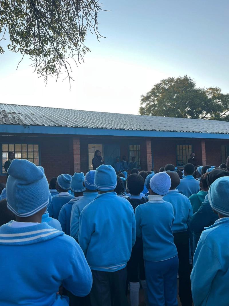 Learners at Bophirima Primary School with their donated copies of Different but Equal.