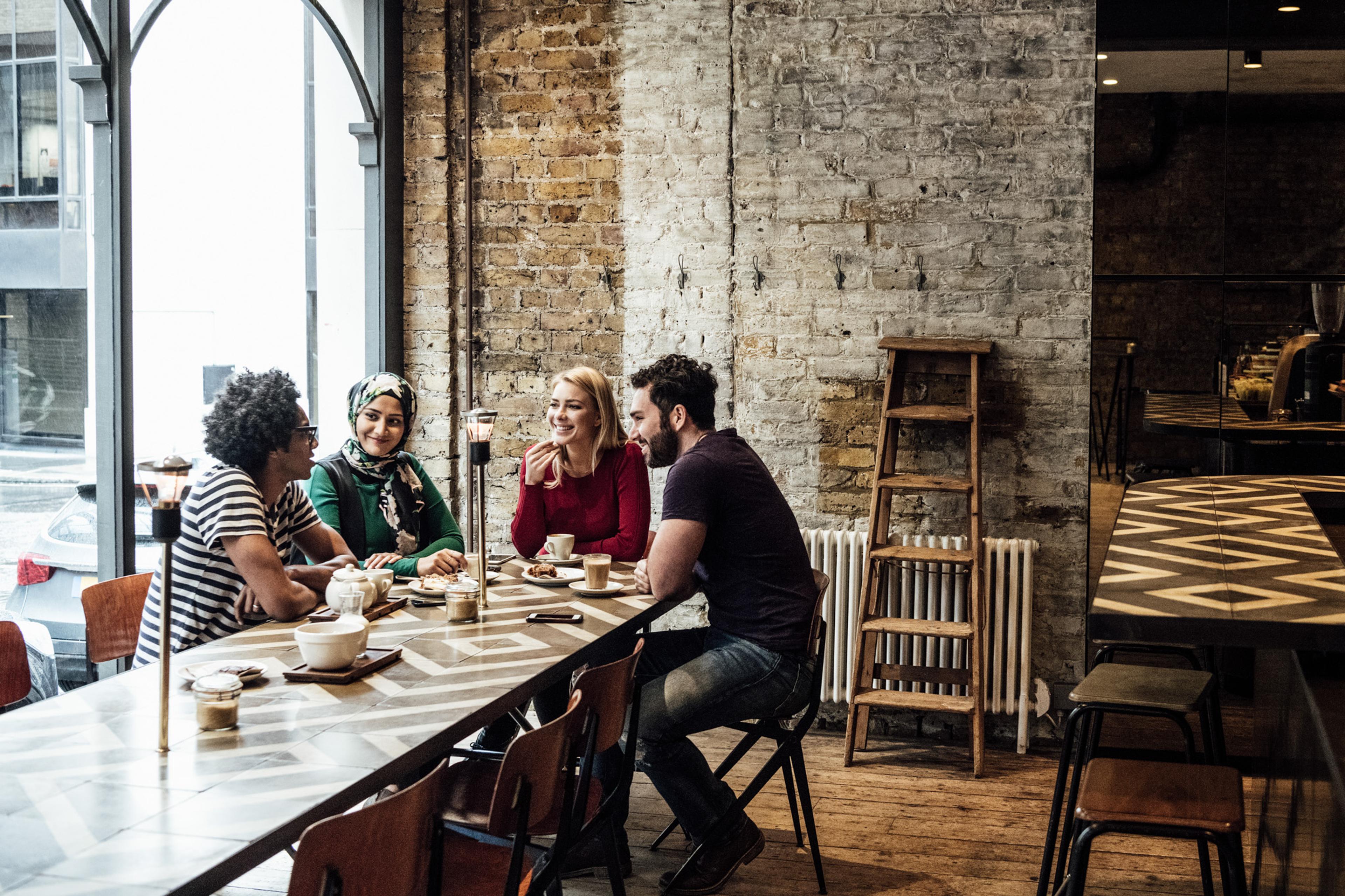 Young group of people around table discussing ideas