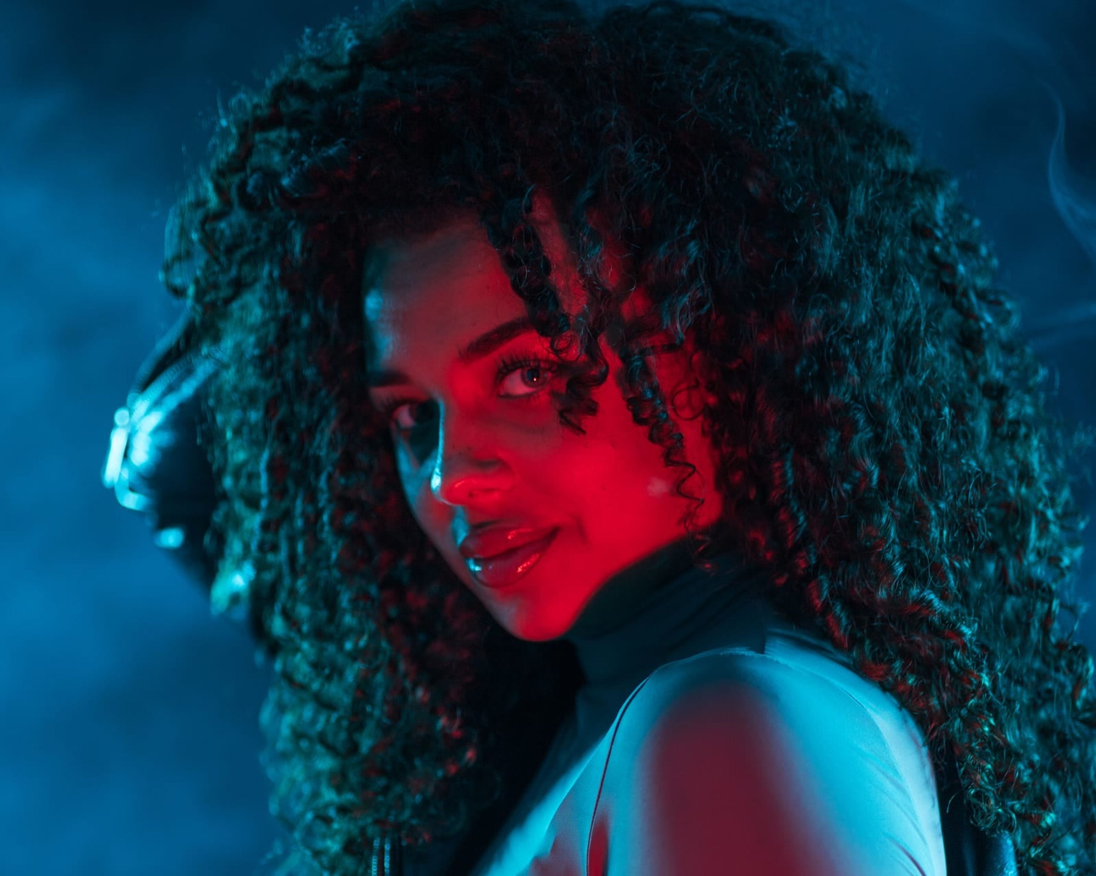 Fashion photo in blue light with smoke