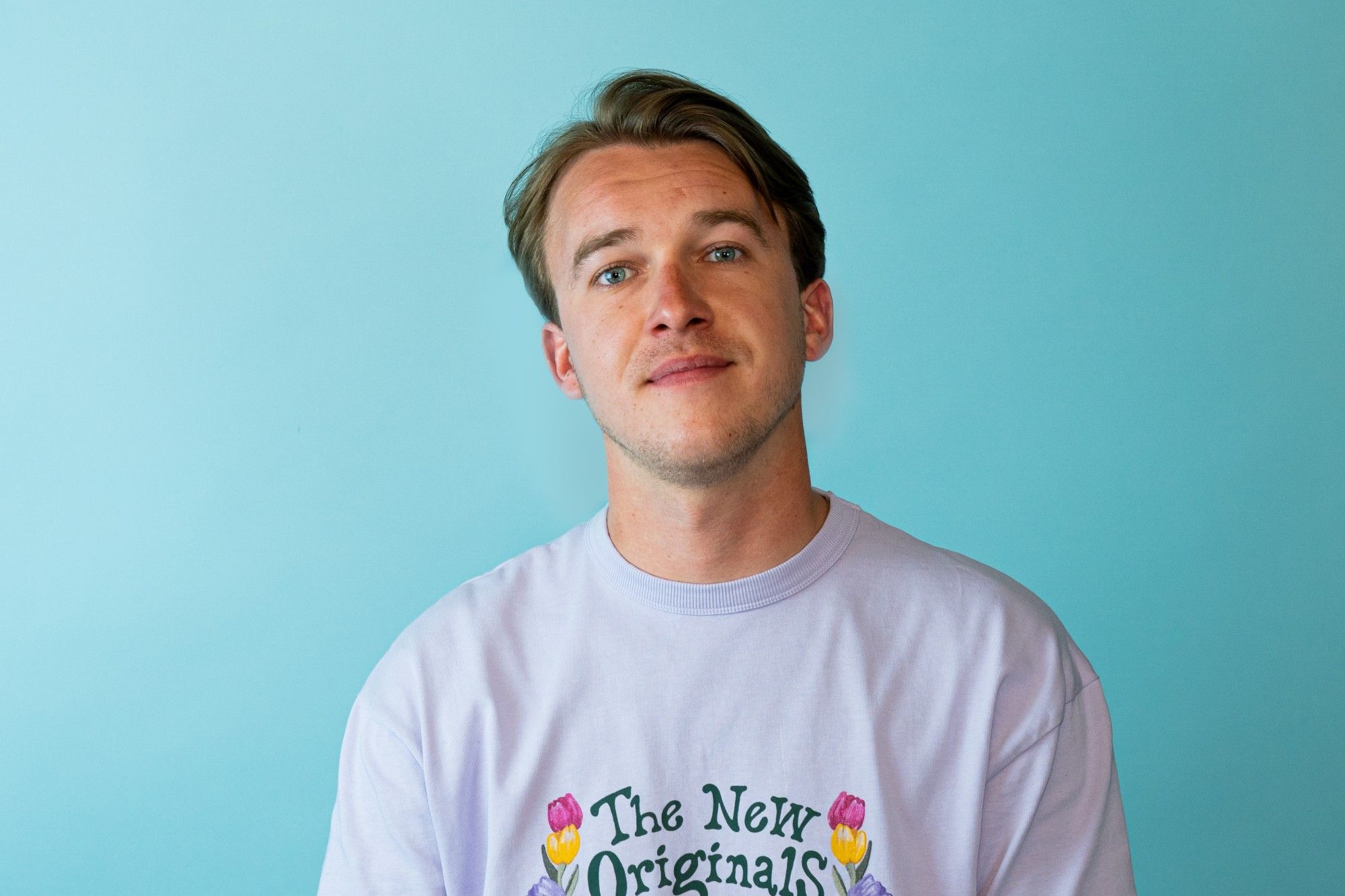 Portrait against a turquoise wall