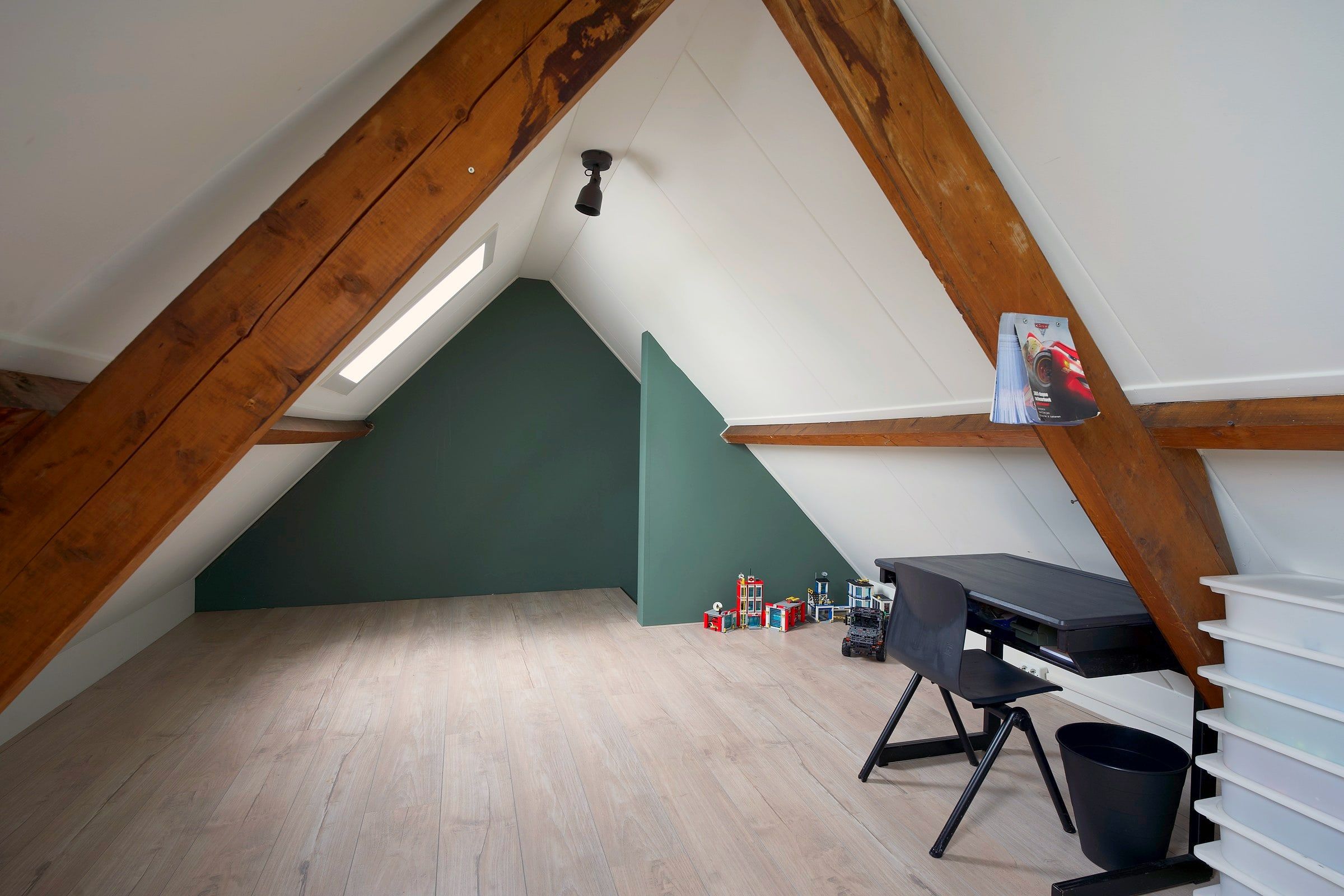 Upstairs room with wooden beams