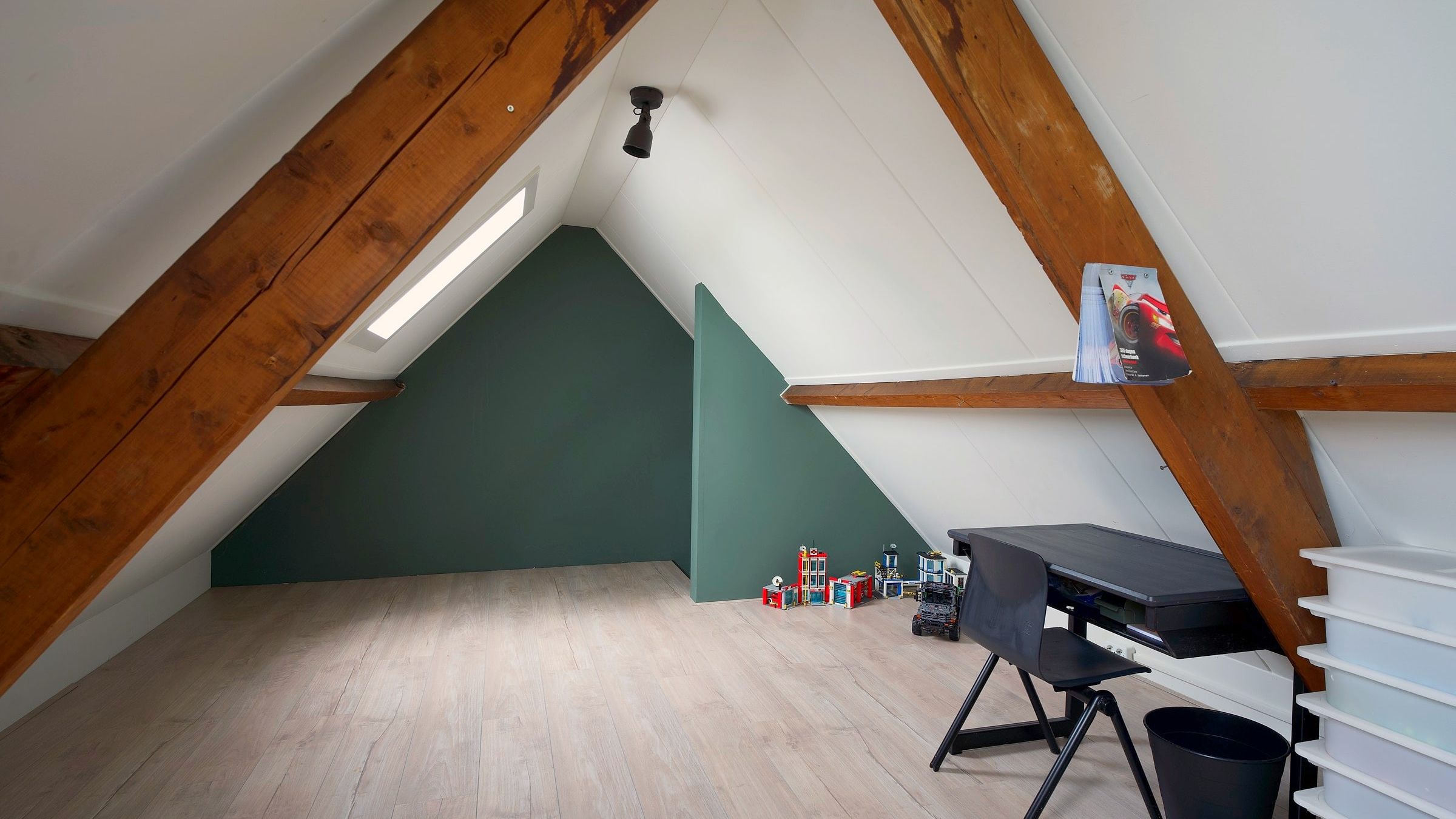 Upstairs room with wooden beams