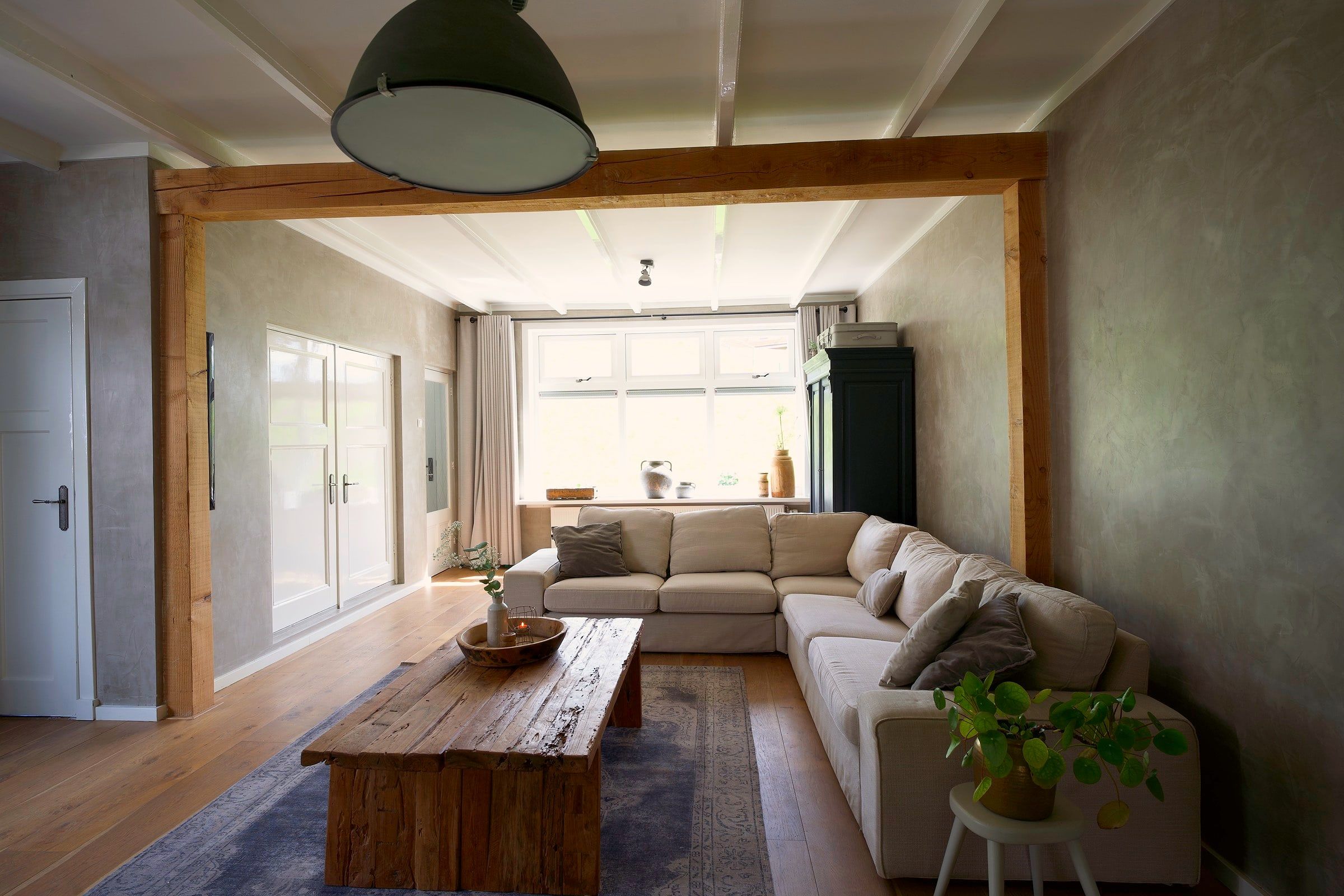 Living room with oak beams and corner sofa