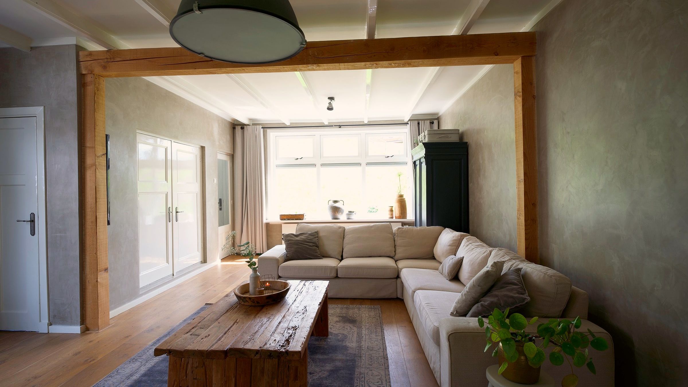Living room with oak beams and corner sofa