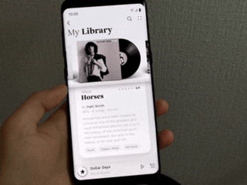 Person trying out music player prototype gif