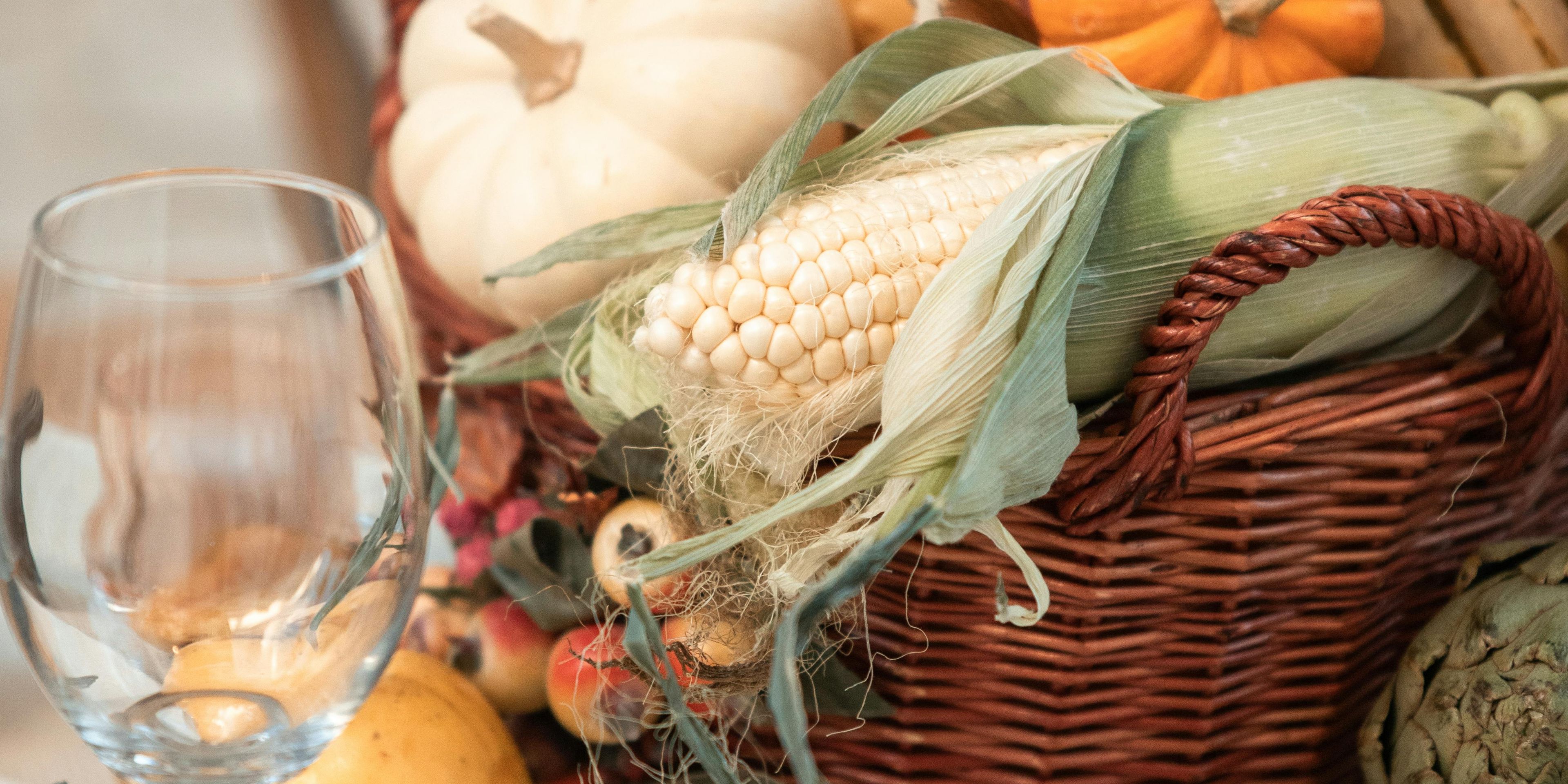 Cornucopia filled with squash and pumpkins, corn and other autumn vegetables