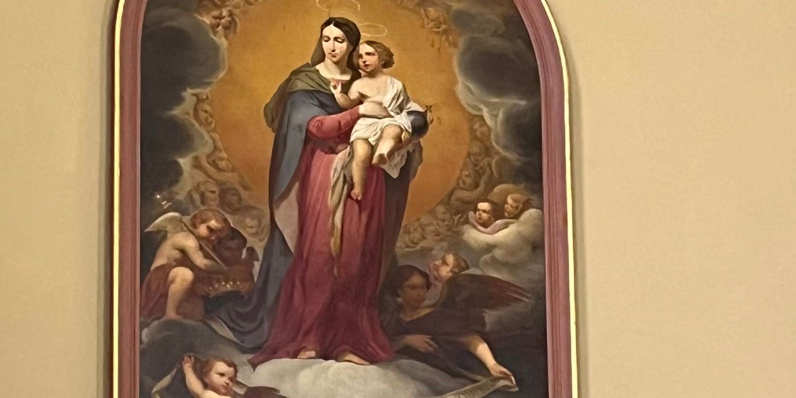 Painting of Mary holding baby Jesus hung in St Louis Cathedral, New Orleans, LA
