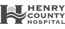 A black and white logo for henry county hospital