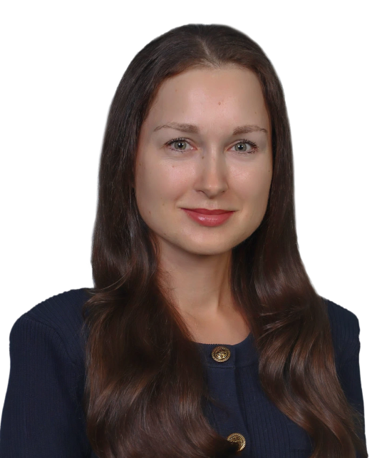 A woman with long dark hair is wearing a blue jacket with gold buttons