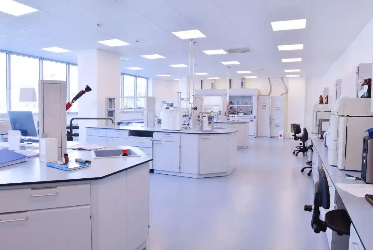 A large empty laboratory with lots of equipment and tables