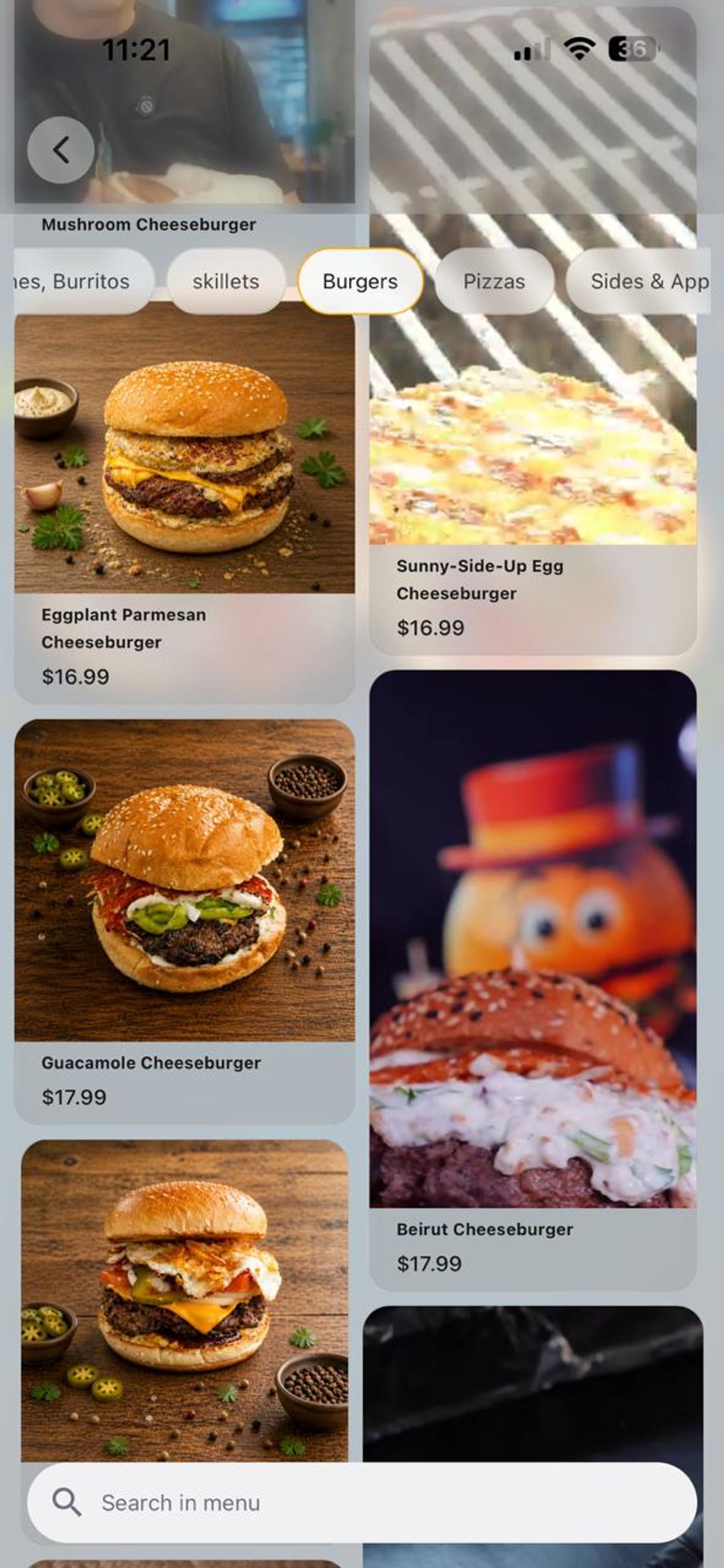 Cravyz restaurant menu showing burger photos, listed prices and menu search to help members plan their meal.