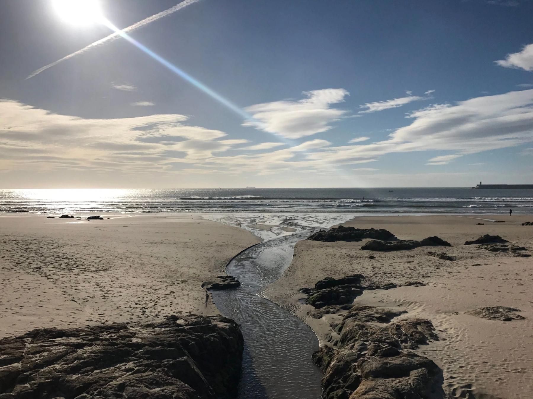 Sand, rocks and Atlantic surf at Praia de Matosinhos, photographed in January 2018