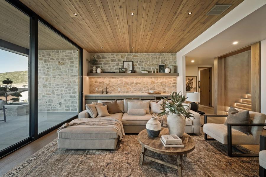 The finished side of the thermal envelope — a Roderick Builders great room at Benloch Ranch, where the wall assembly holds 72 degrees against a Wasatch winter