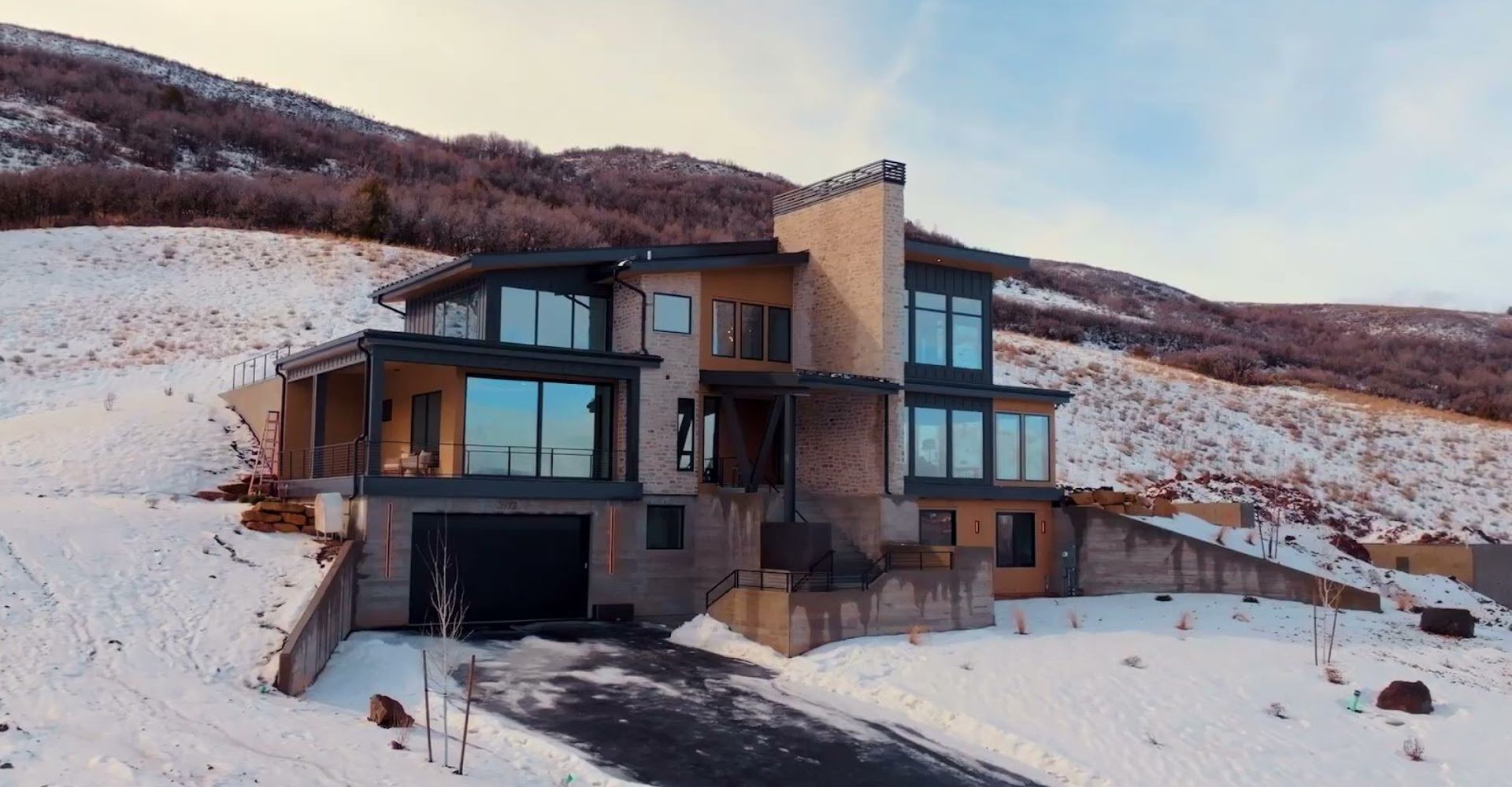 Benloch Ranch Lot 112 modern mountain home winter exterior aerial view Heber City Utah