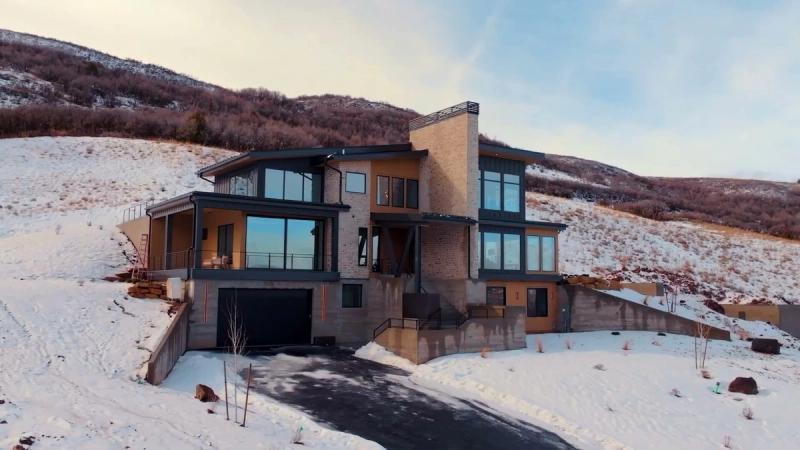 Benloch Ranch Lot 112 modern mountain home winter exterior aerial view Heber City Utah