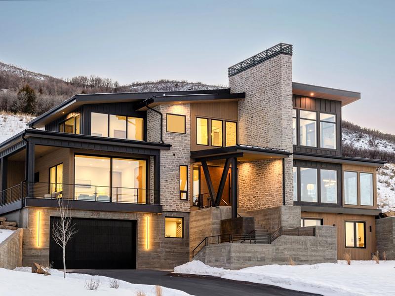 luxury mountain home exterior night view architectural lighting Benloch Ranch modern design Park City