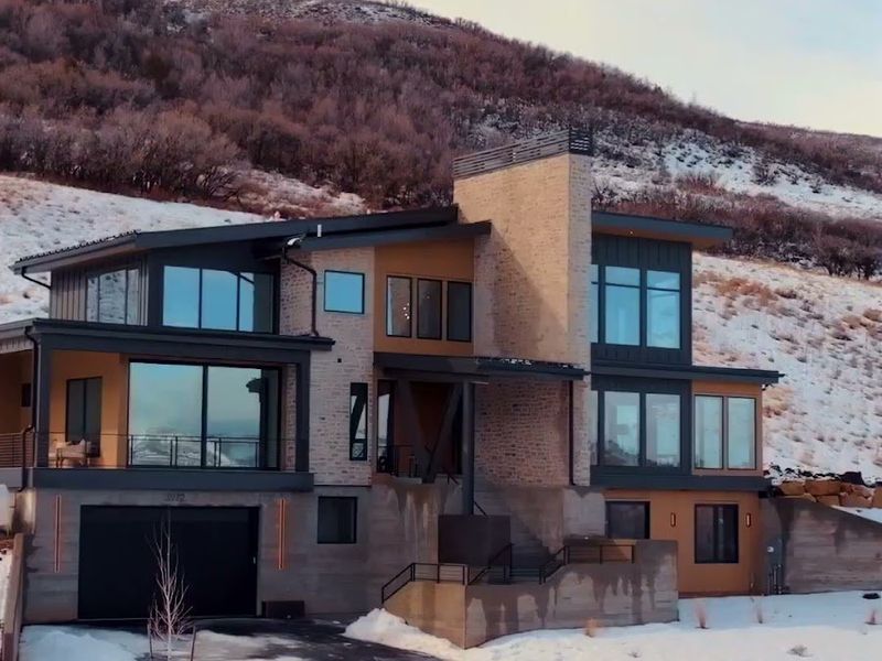 Benloch Ranch Lot 112 luxury home snow-covered brick facade winter exterior Park City Utah