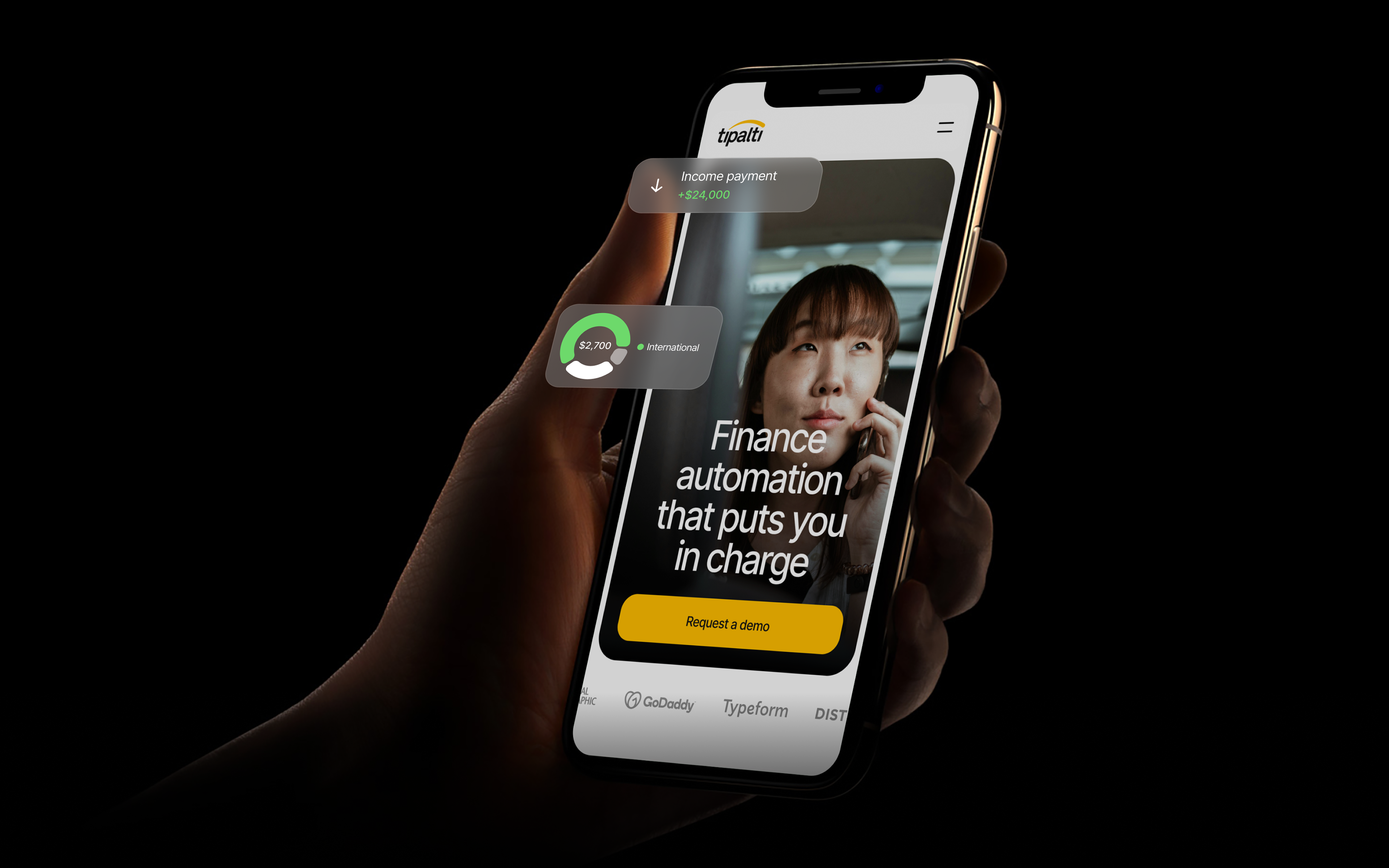 A person holding a mobile phone with the Tipalti app opened