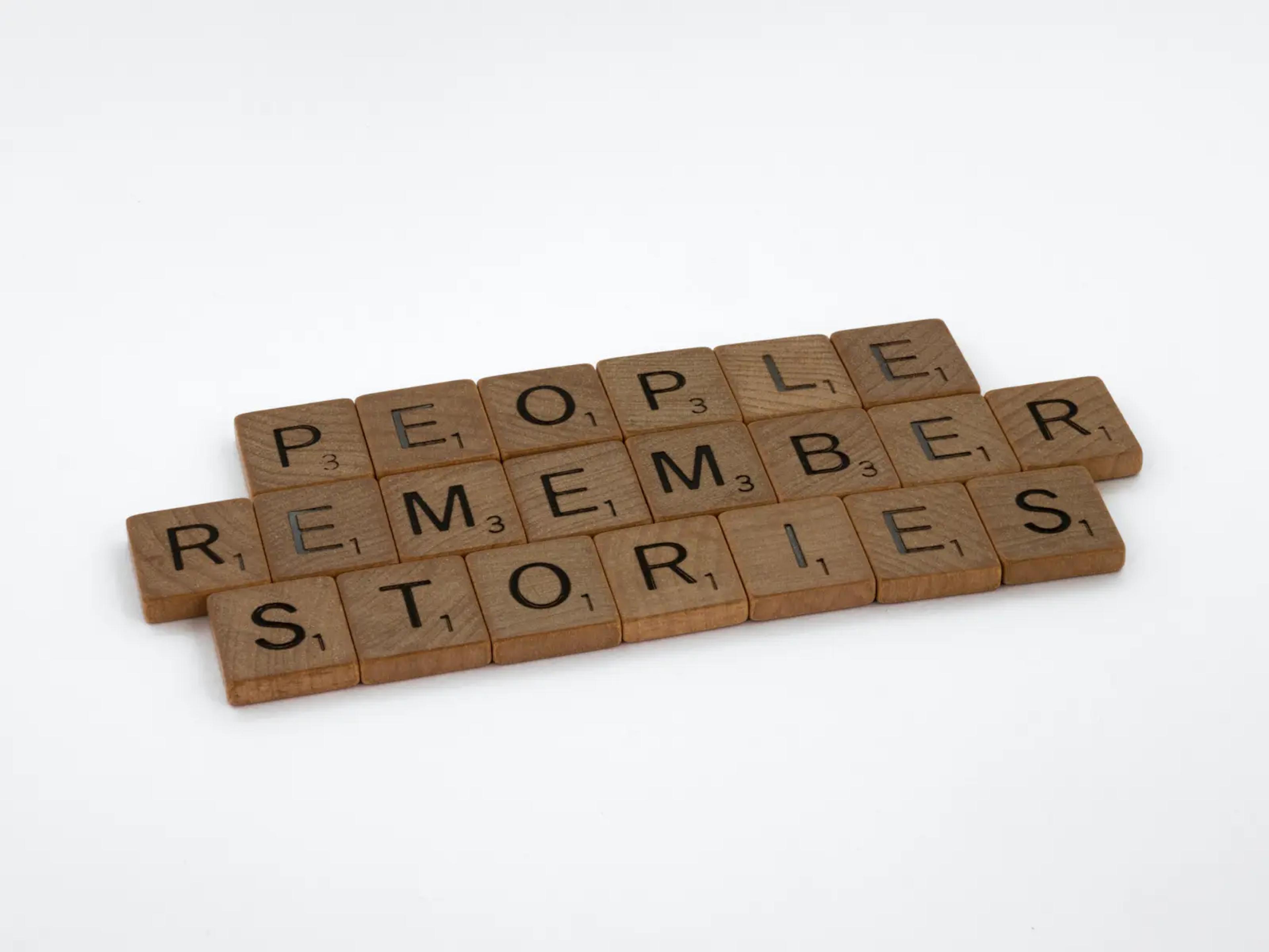 wooden letters text "people remember stories"