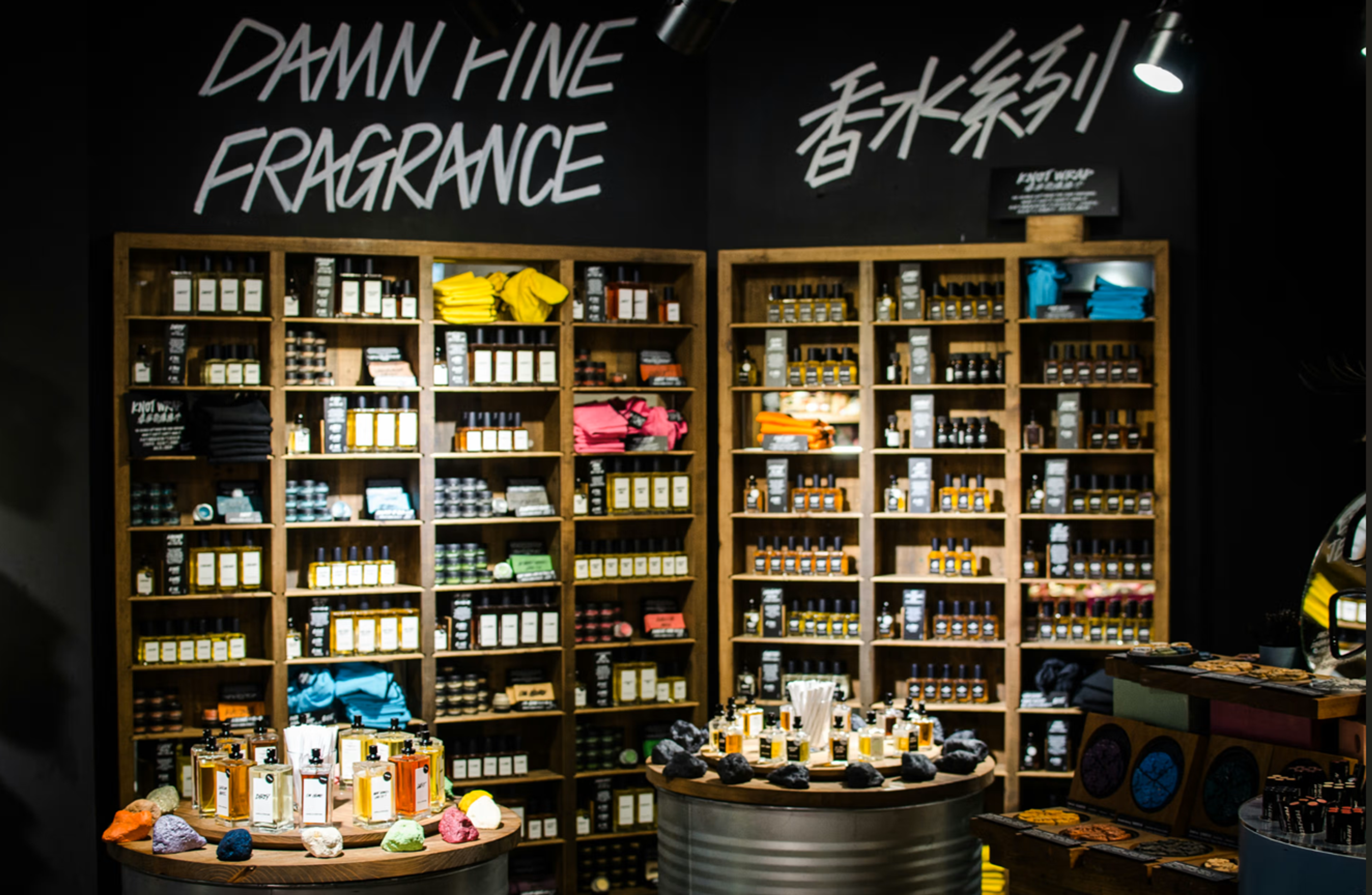 Fragrance store display with colorful products and bold signage