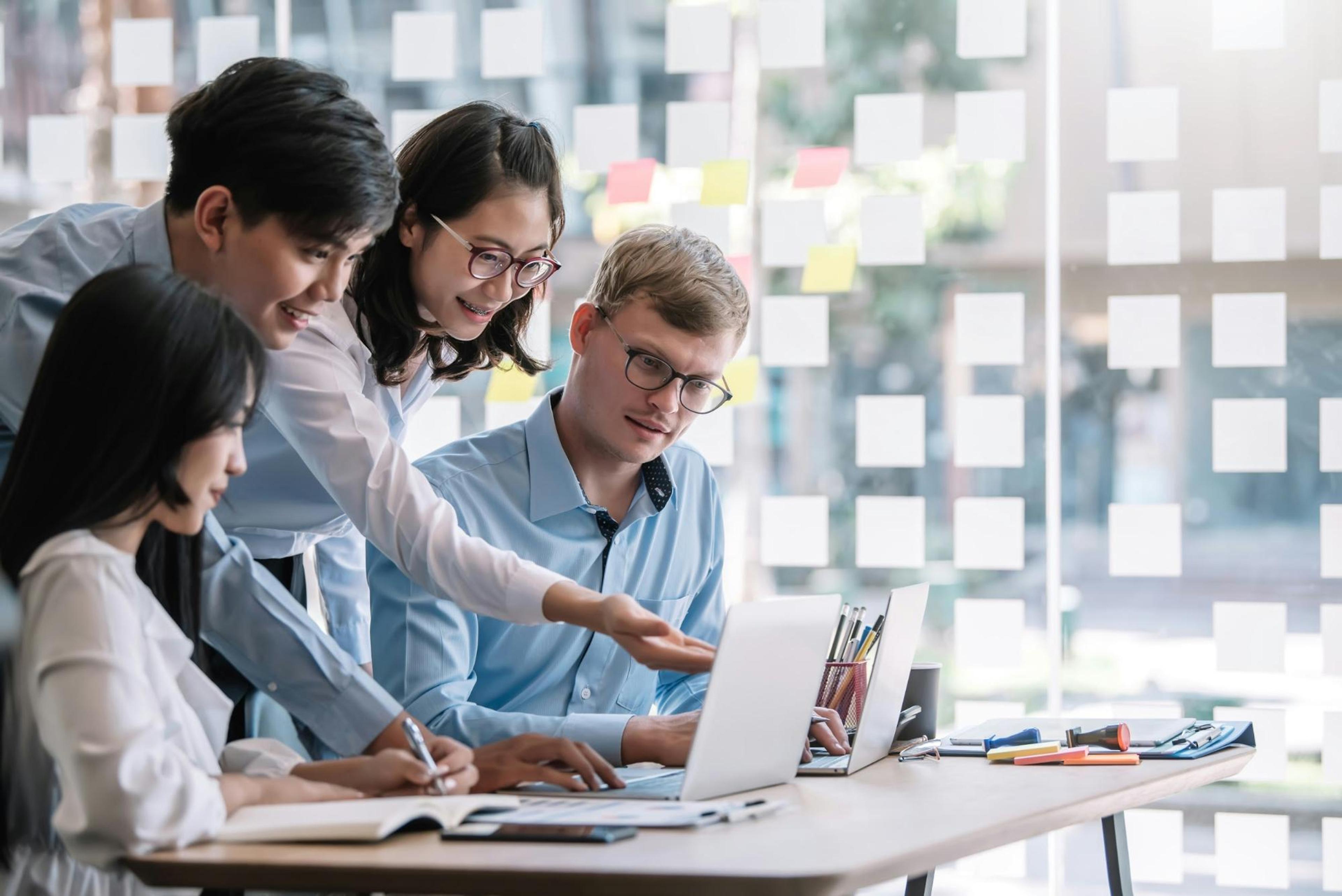 A group of people at a computer