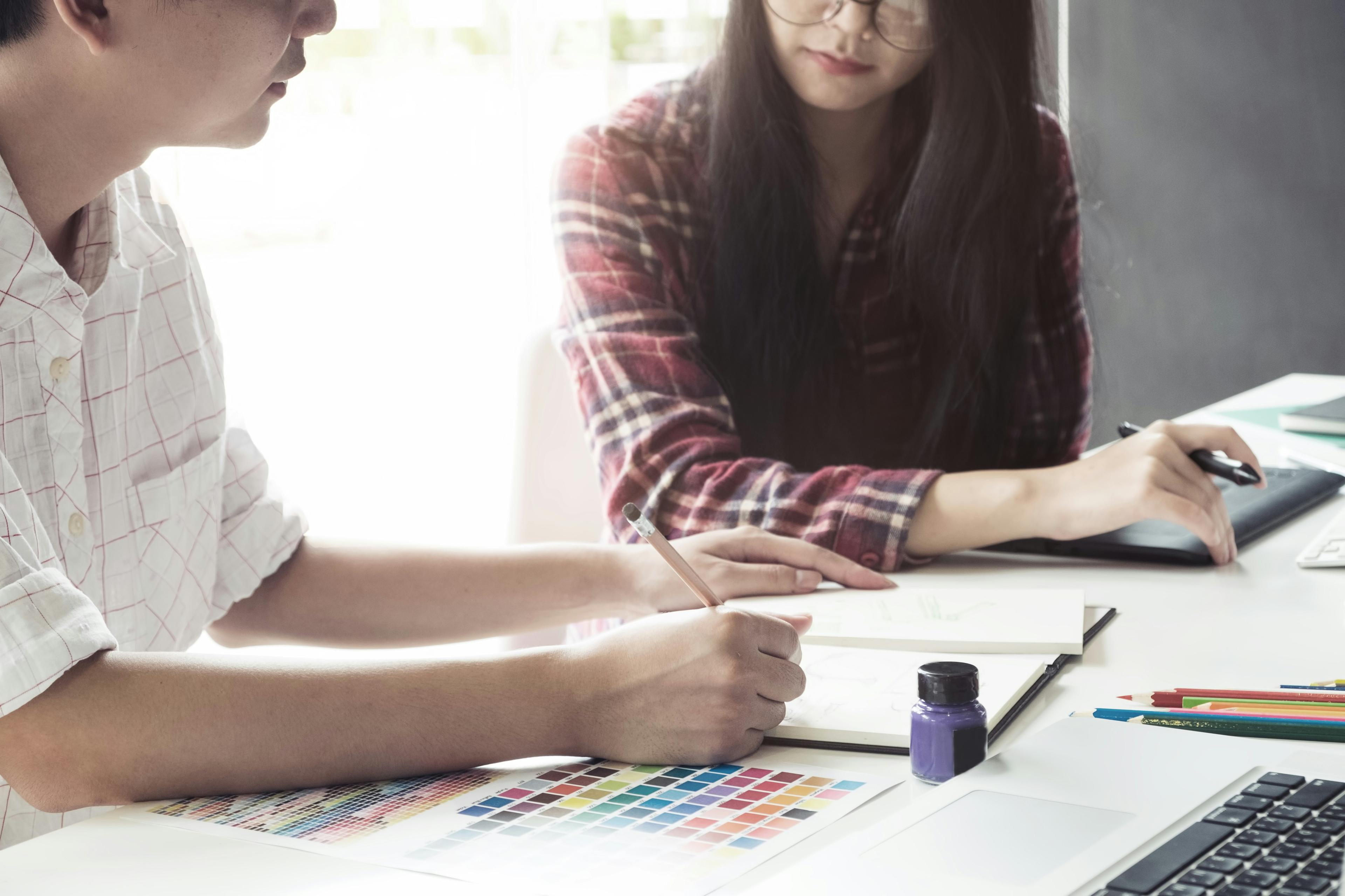 A guy and a girl sitting at a table