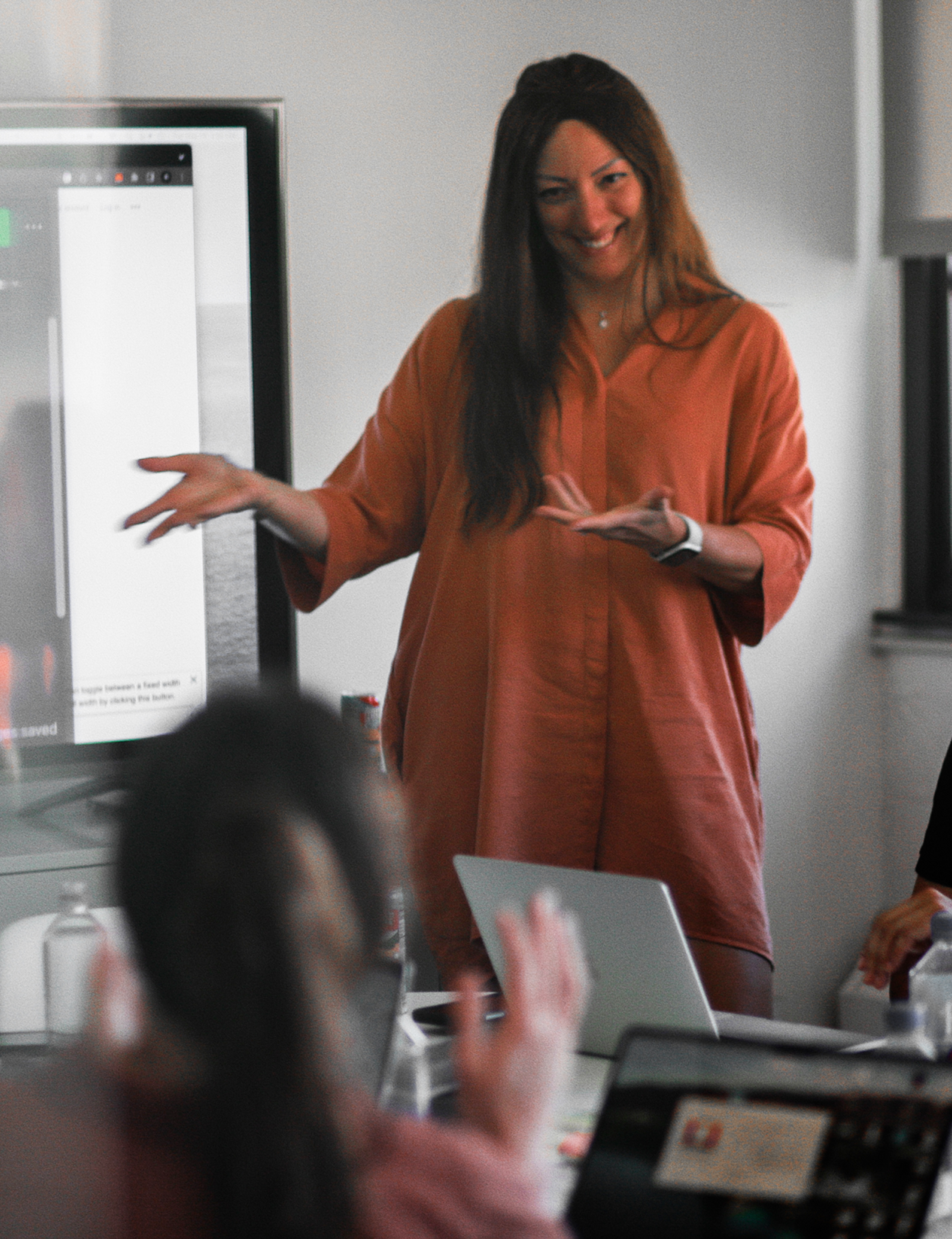a person standing in front of a white board